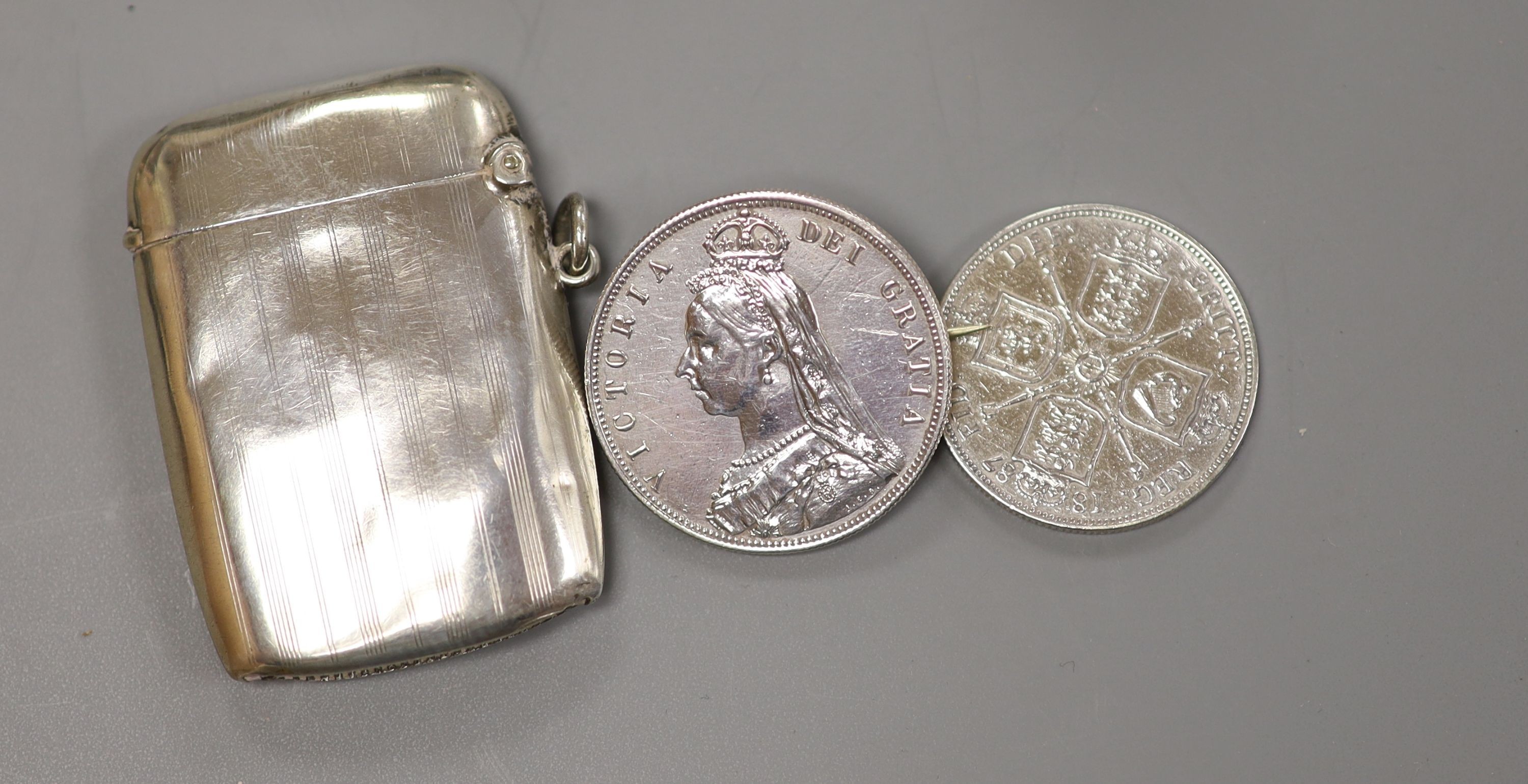 A silver cigarette case, Georgian silver caddy spoon, London, 1817, a pair of silver salts, etc.
